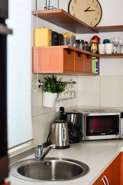Kitchenette with microwave and kettle