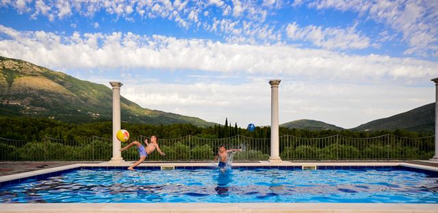 Guests swimming in the pool