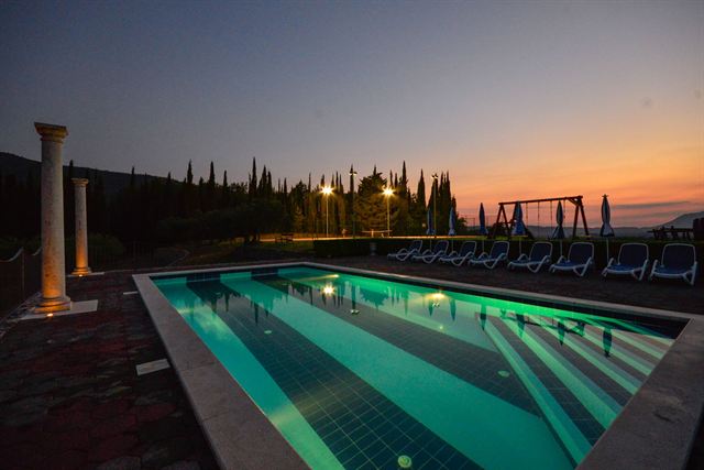 The pool lit up at dusk