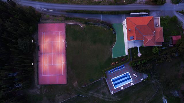 Aerial view of the villa, courts and pool